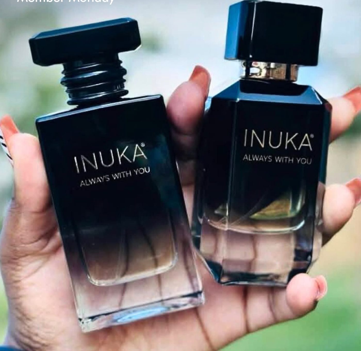 INUKA Signature perfumes in hand
